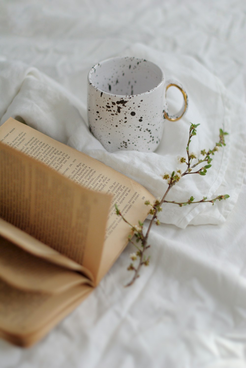 brown book on white textile