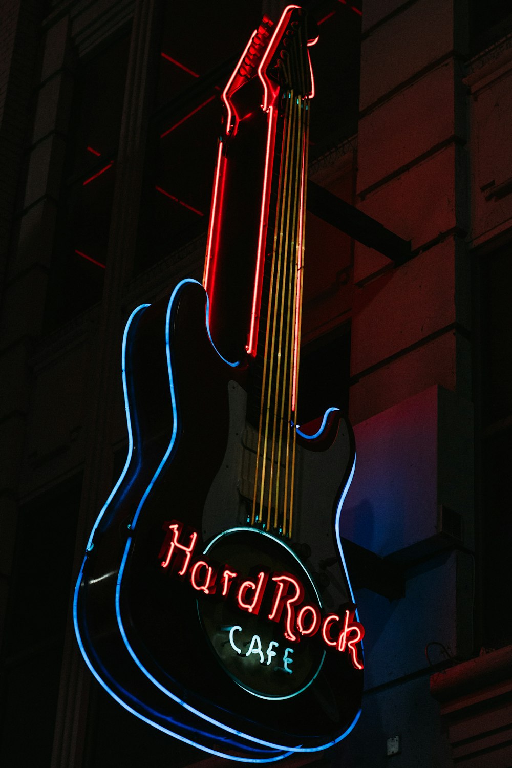 a neon sign that says hard rock cafe