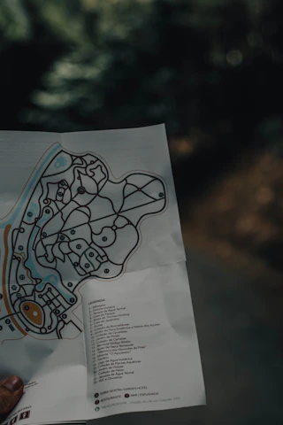 A vibrant map with highlighted travel routes and a compass overlay symbolizing guidance.