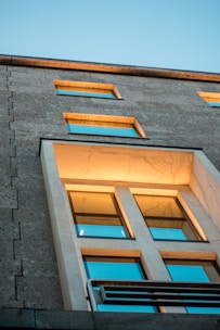 A modern commercial building bathed in warm sunlight, symbolizing growth.