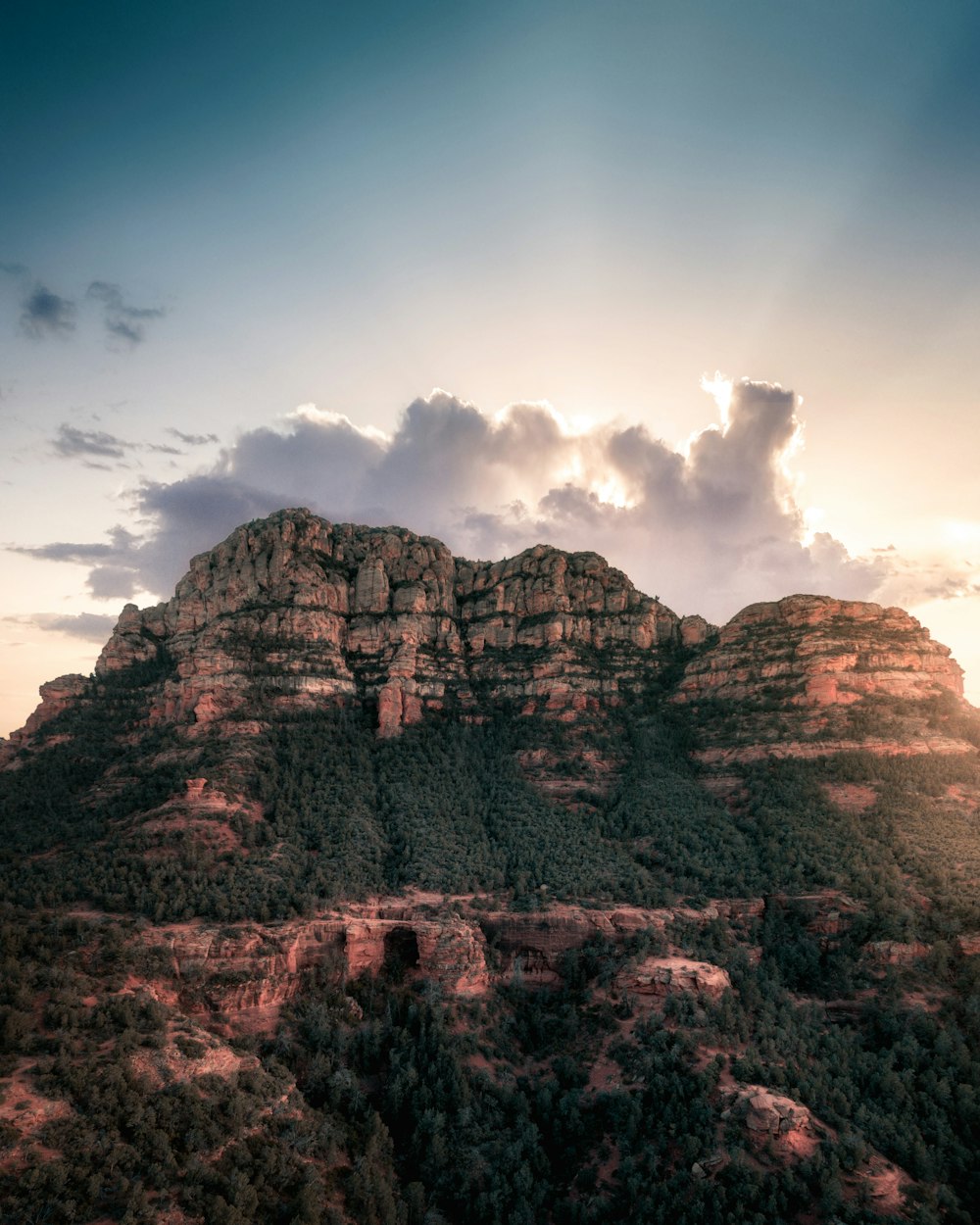 brown rocky mountain under blue sky