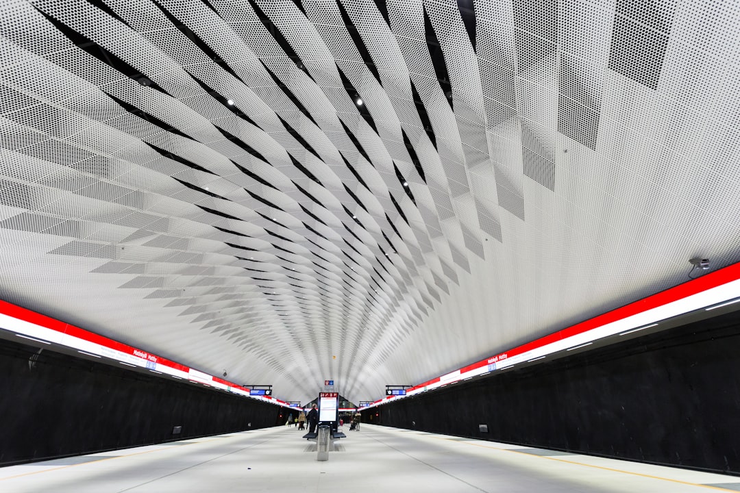 white and red road in tunnel