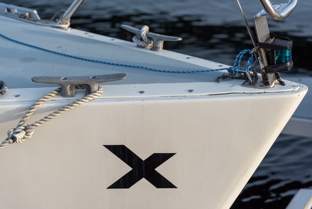 white and black boat on water during daytime