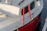 Close-up of a 3D printed nautical accessory attached to a sailboat.
