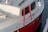 A close-up of a well-fitted sprayhood on a sailboat.