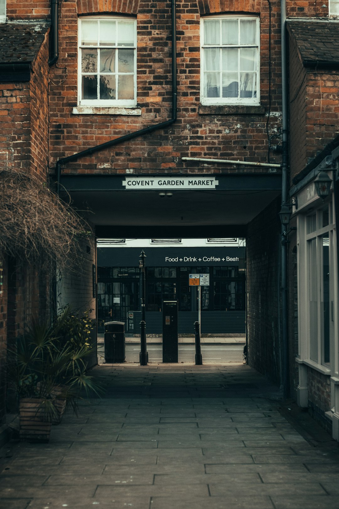 brown brick building with brown wooden door