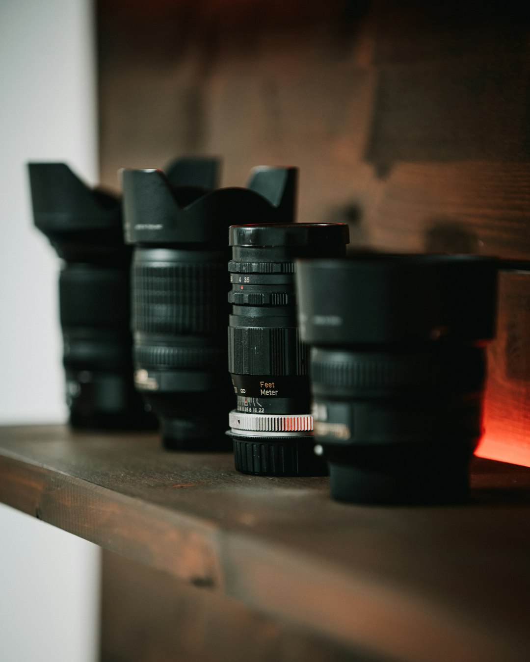 black dslr camera lens on brown wooden table