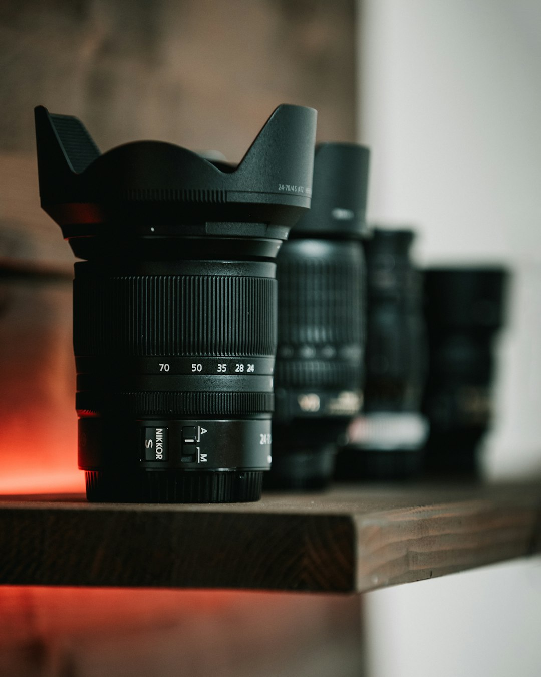 black camera lens on brown wooden table