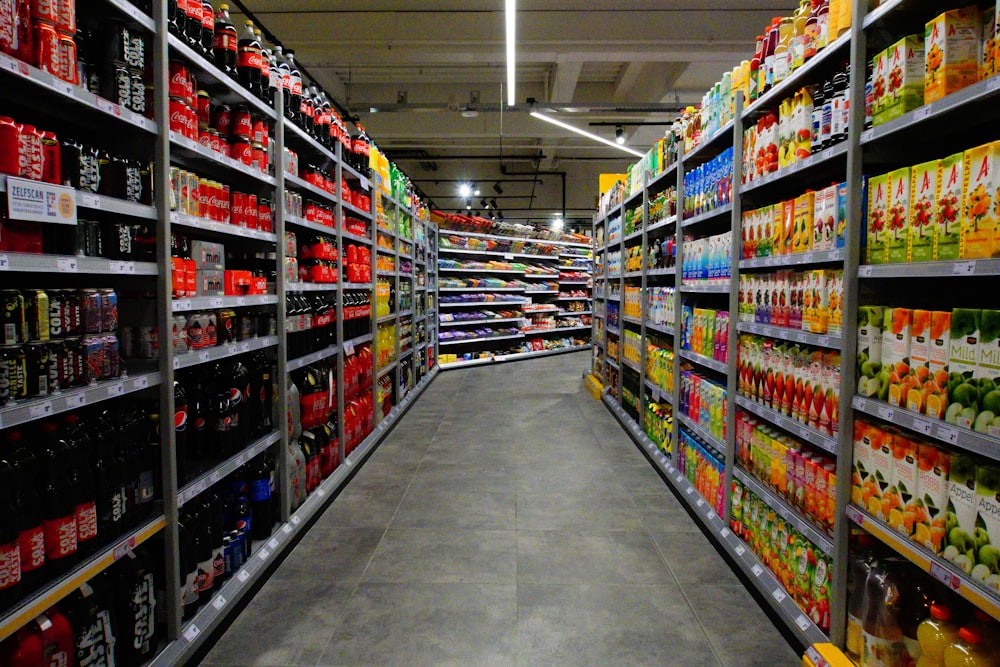 red and white labeled bottle on shelf