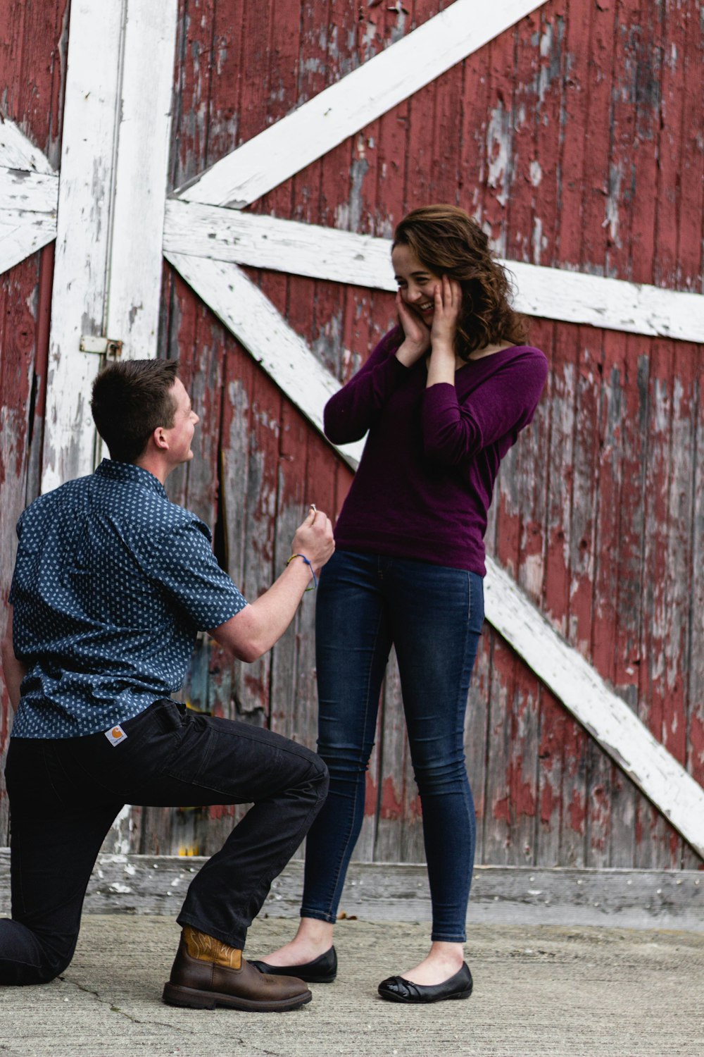 man and woman standing on wooden stairs