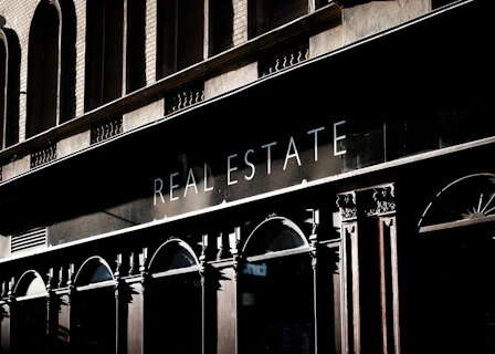 brown concrete building with glass windows