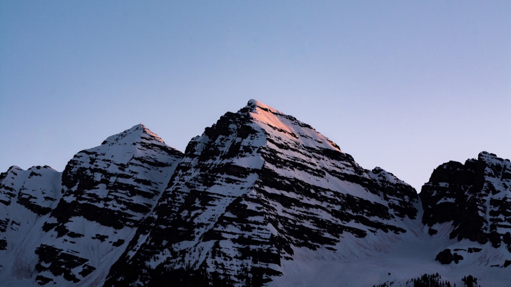 snow covered mountain under blue sky during daytime