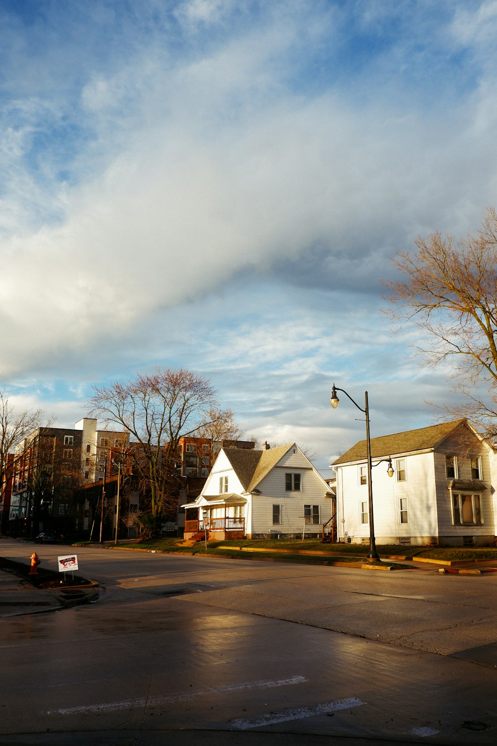 cars parked in front of white building during daytime