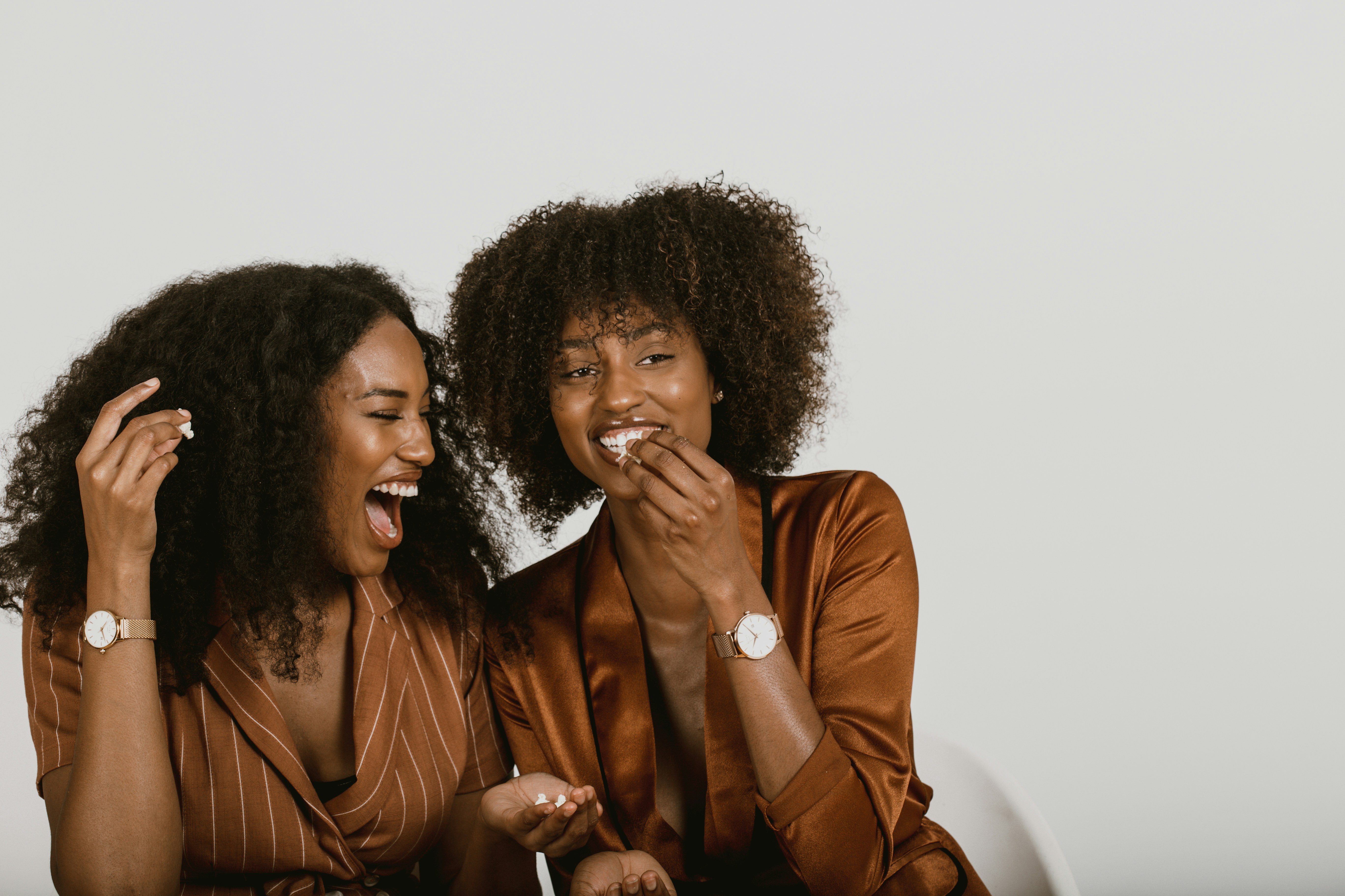 woman in brown leather jacket beside woman in brown leather jacket