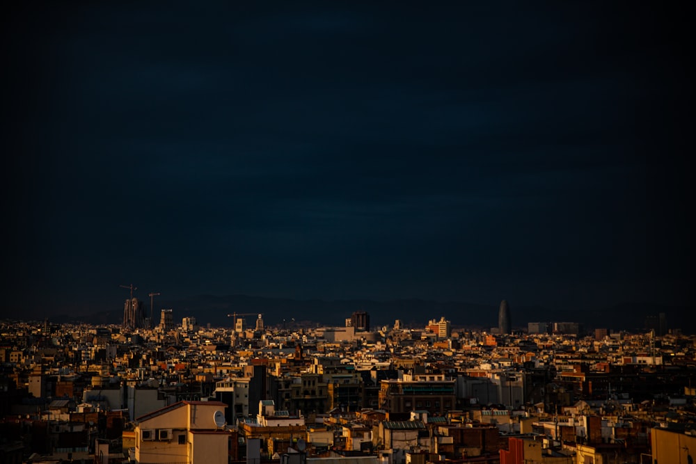 city with high rise buildings during night time