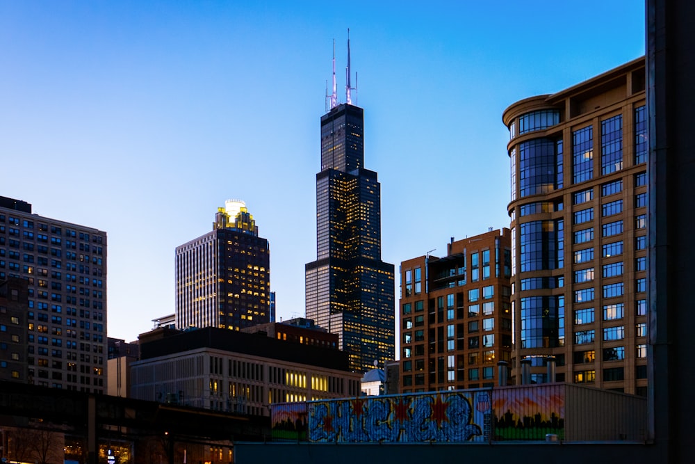 brown and black high rise buildings under blue sky during daytime