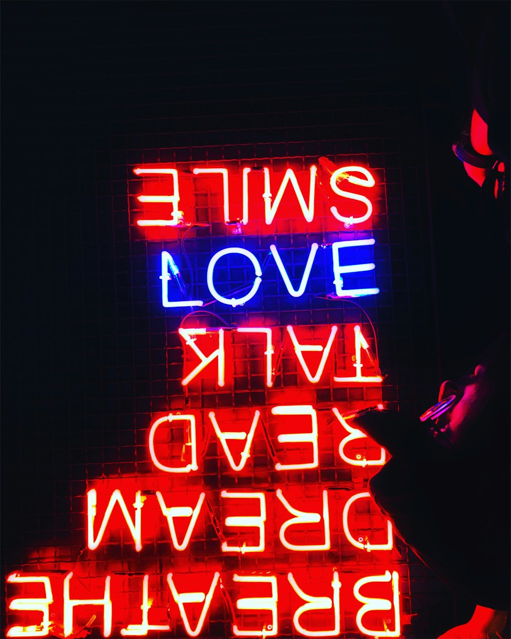 a neon sign that reads swine evol