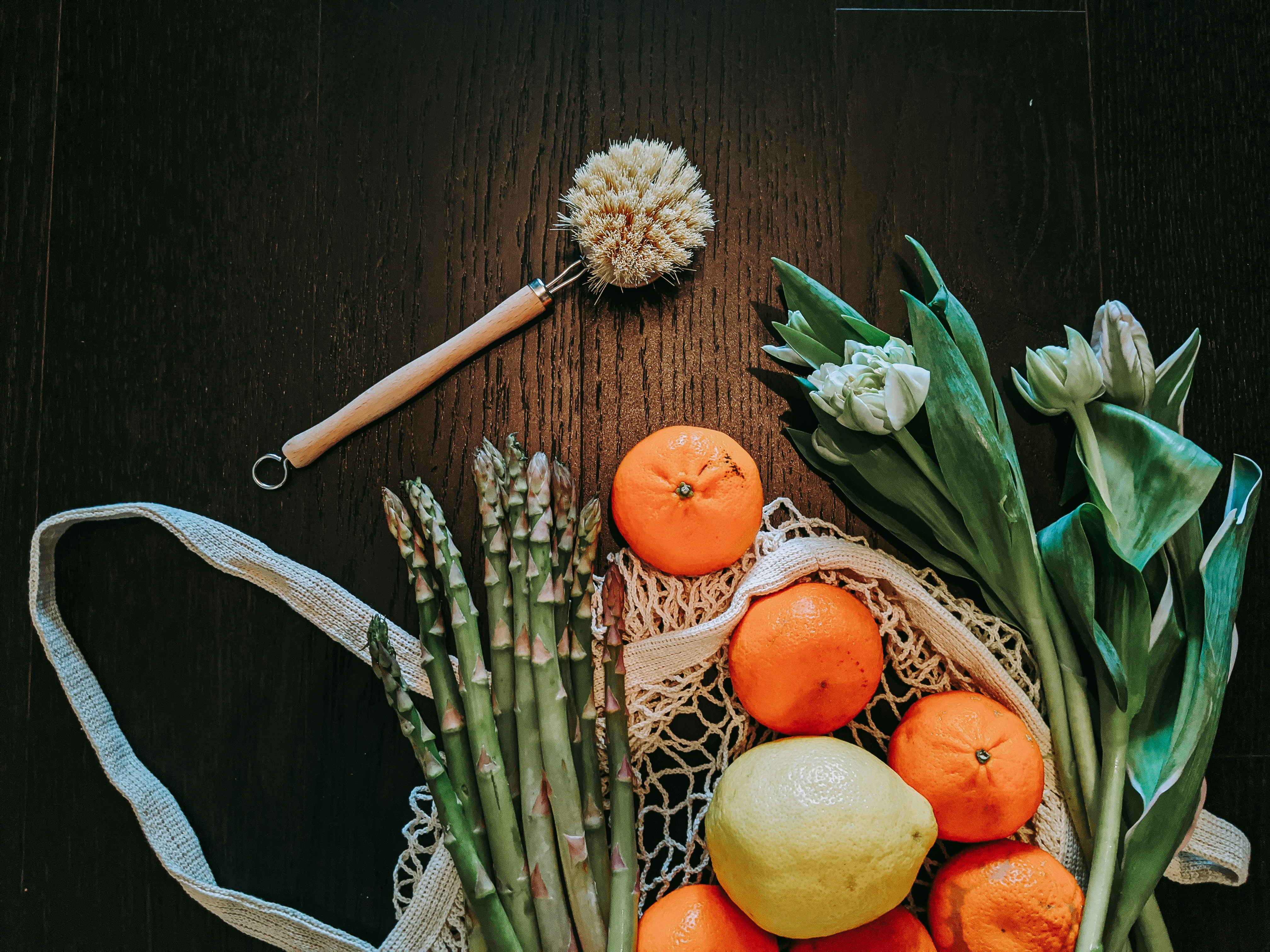 Eggs and specialty produce items on rustic dark wooden surface, warm ambient lighting
