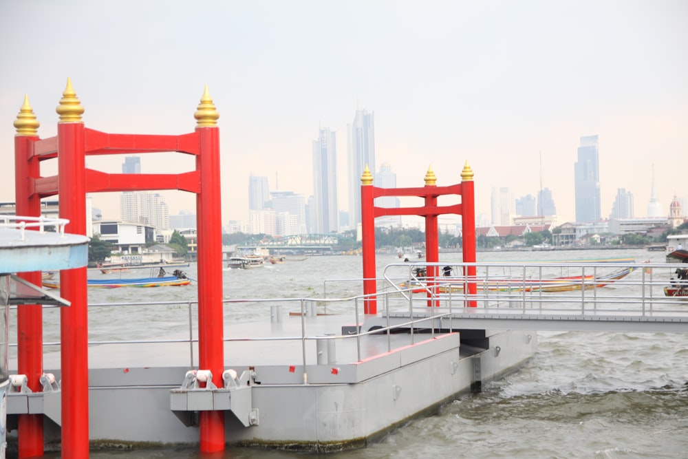 red and white metal stand on white ship during daytime