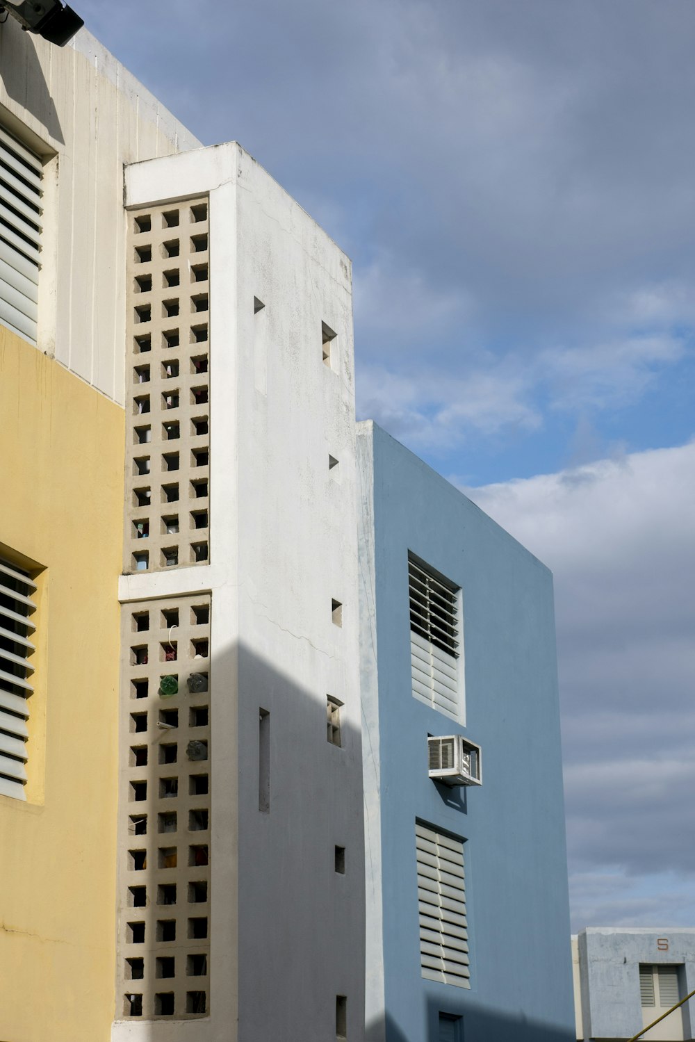 white concrete building under blue sky during daytime