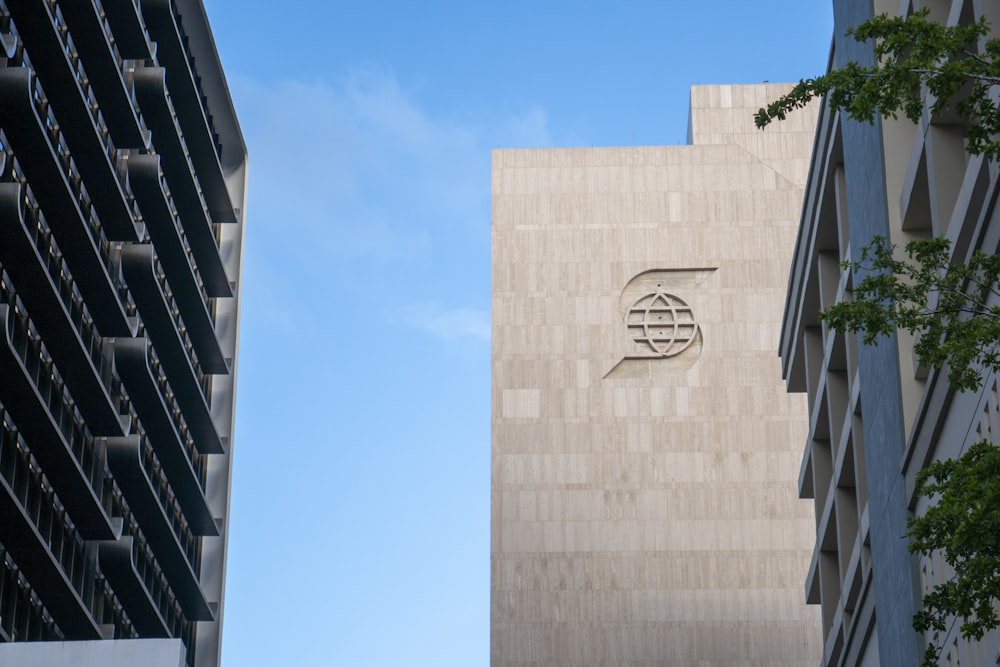 beige concrete building under blue sky during daytime