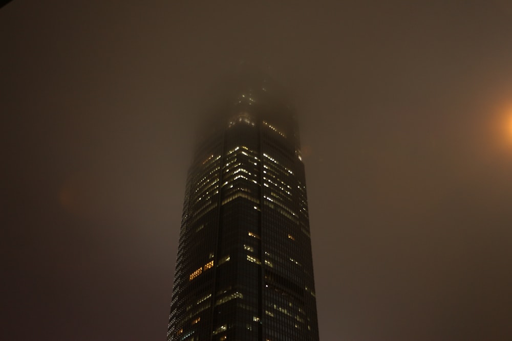 black high rise building during night time