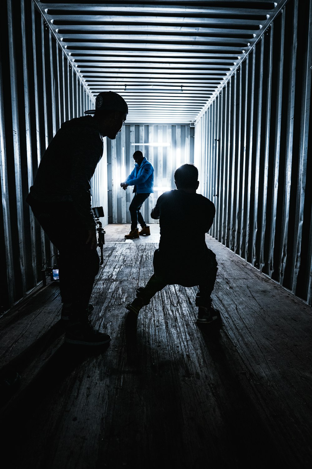 a group of people standing in a dark room