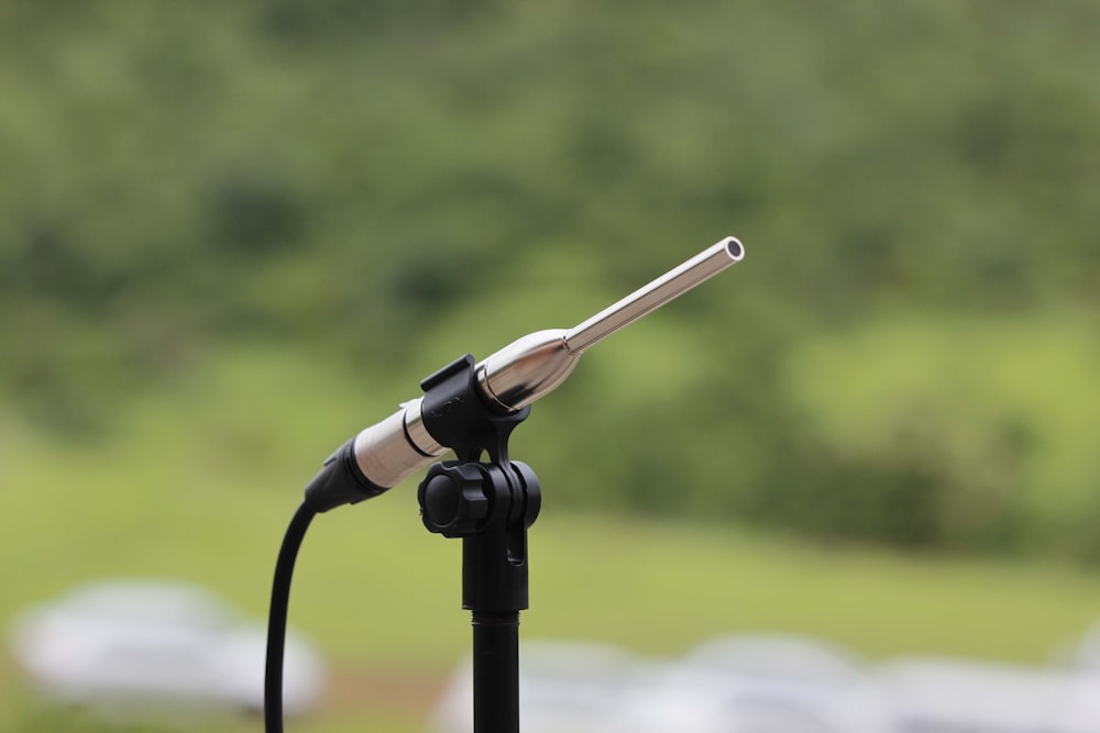 black and silver microphone with stand