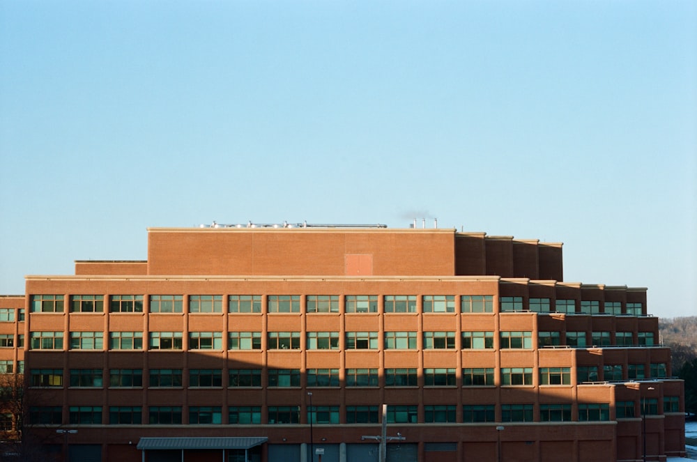 brown concrete building under blue sky during daytime