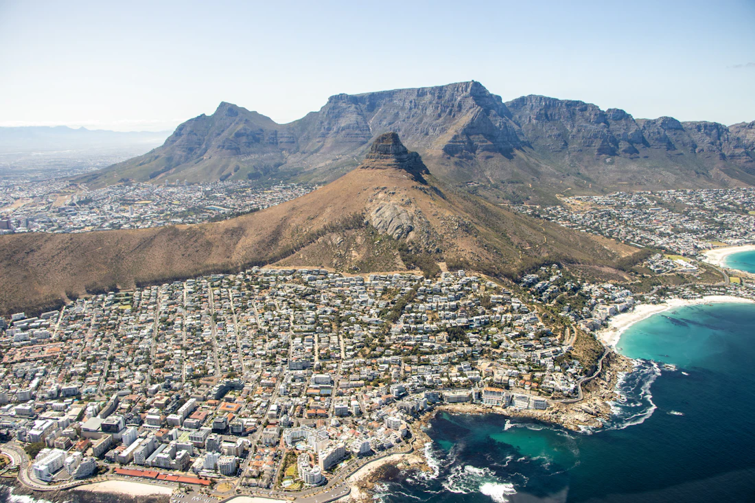 Table Mountain rising above the city bowl and the Atlantic coastline of Cape Town, South Africa