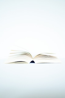 white book page on black surface
