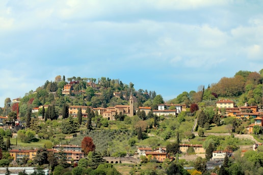 Scenic view of the Nebrodi hills with a cozy villa nestled among trees.