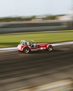 red and white car on road