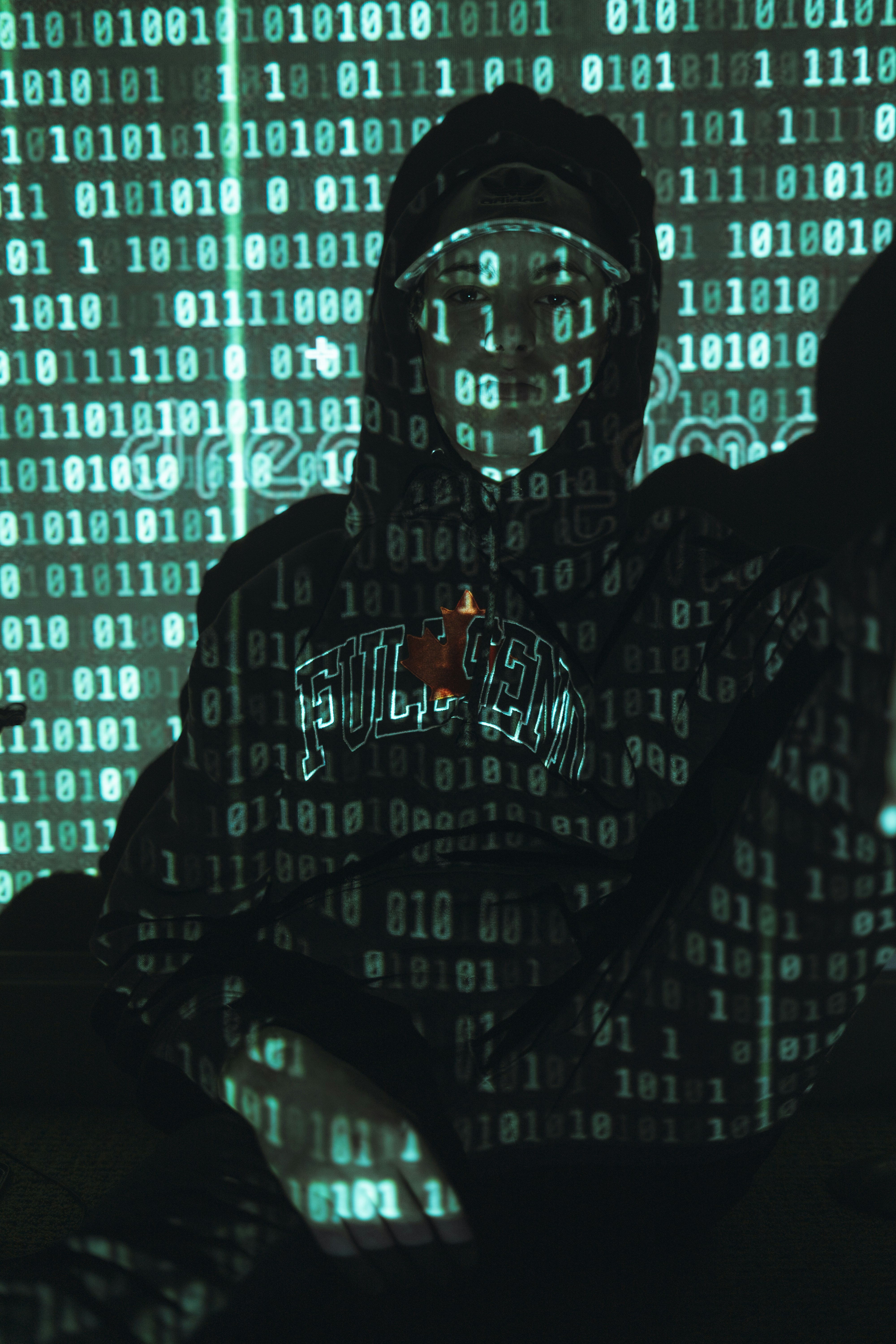 man in black hoodie standing