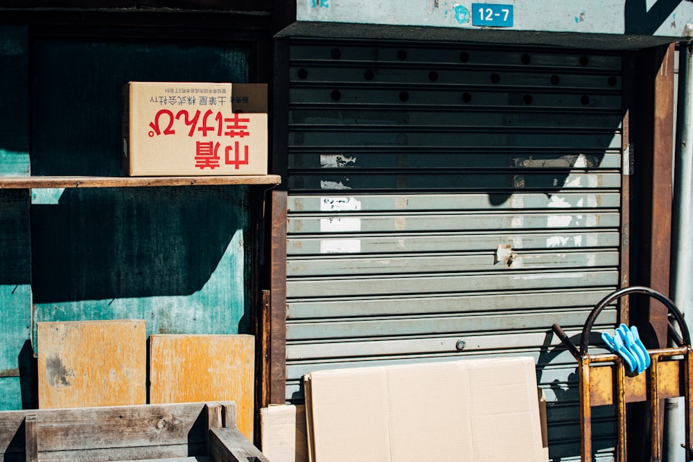 brown wooden bench beside blue wooden door