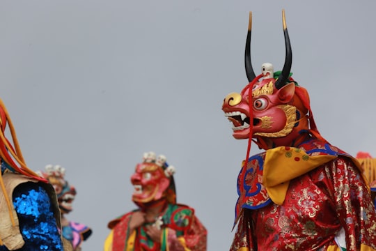 person in red and yellow mask in Dochula Bhutan