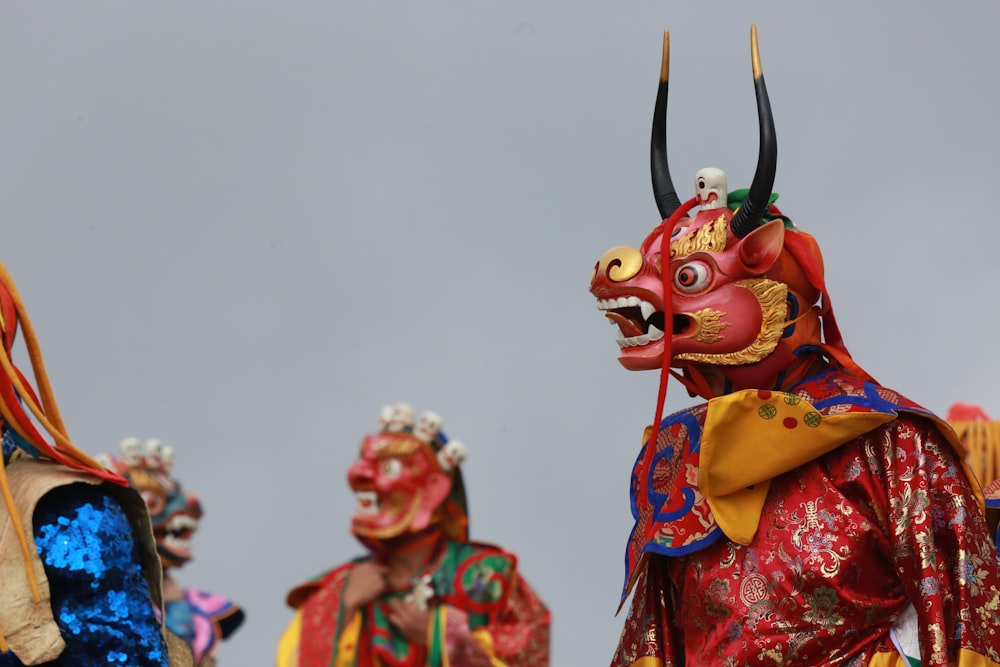 person in red and yellow mask