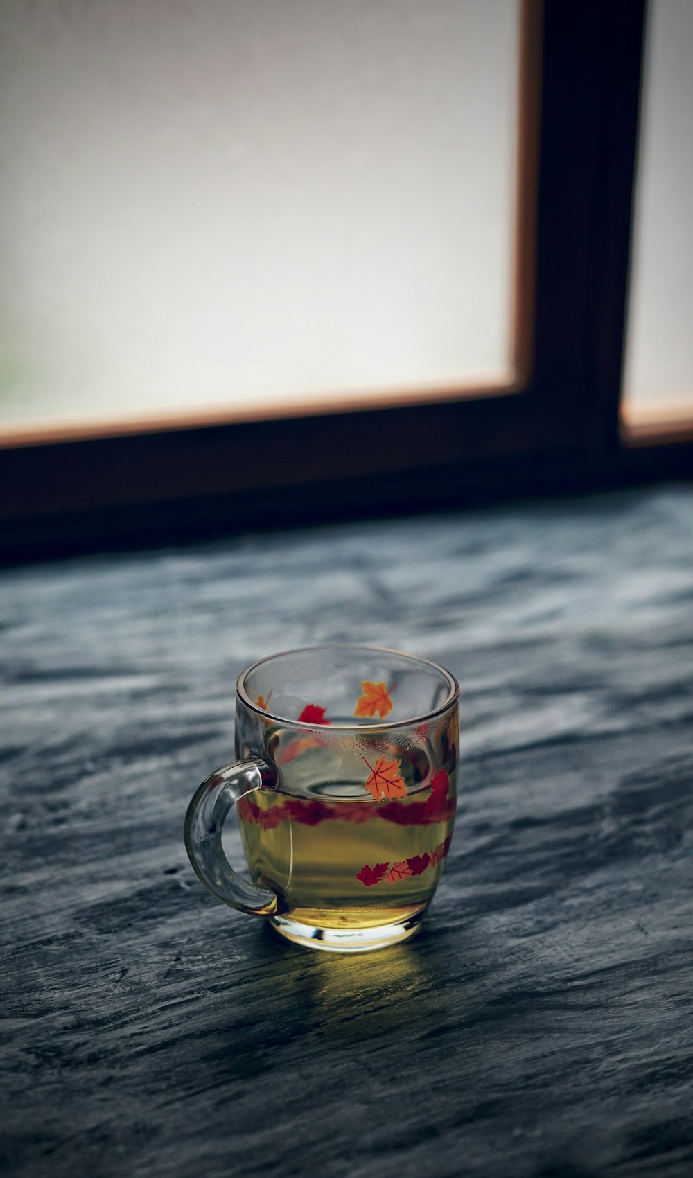 clear glass mug on black table