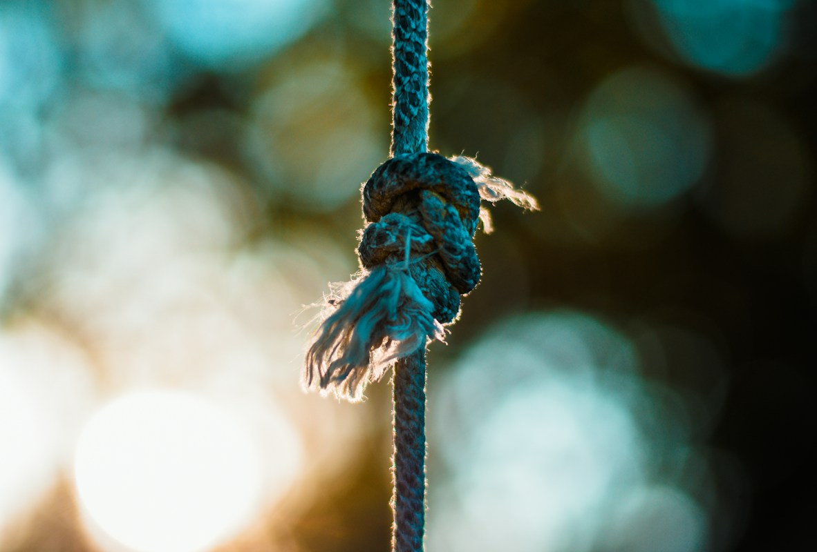 Close-up of a knotted blue rope