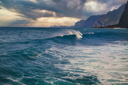 ocean waves crashing on shore during daytime in Porto da Cruz Portugal