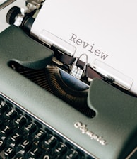 black and white typewriter on white table