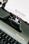 black and white typewriter on white table