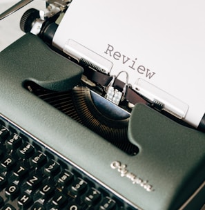 black and white typewriter on white table