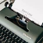 black and white typewriter on white table