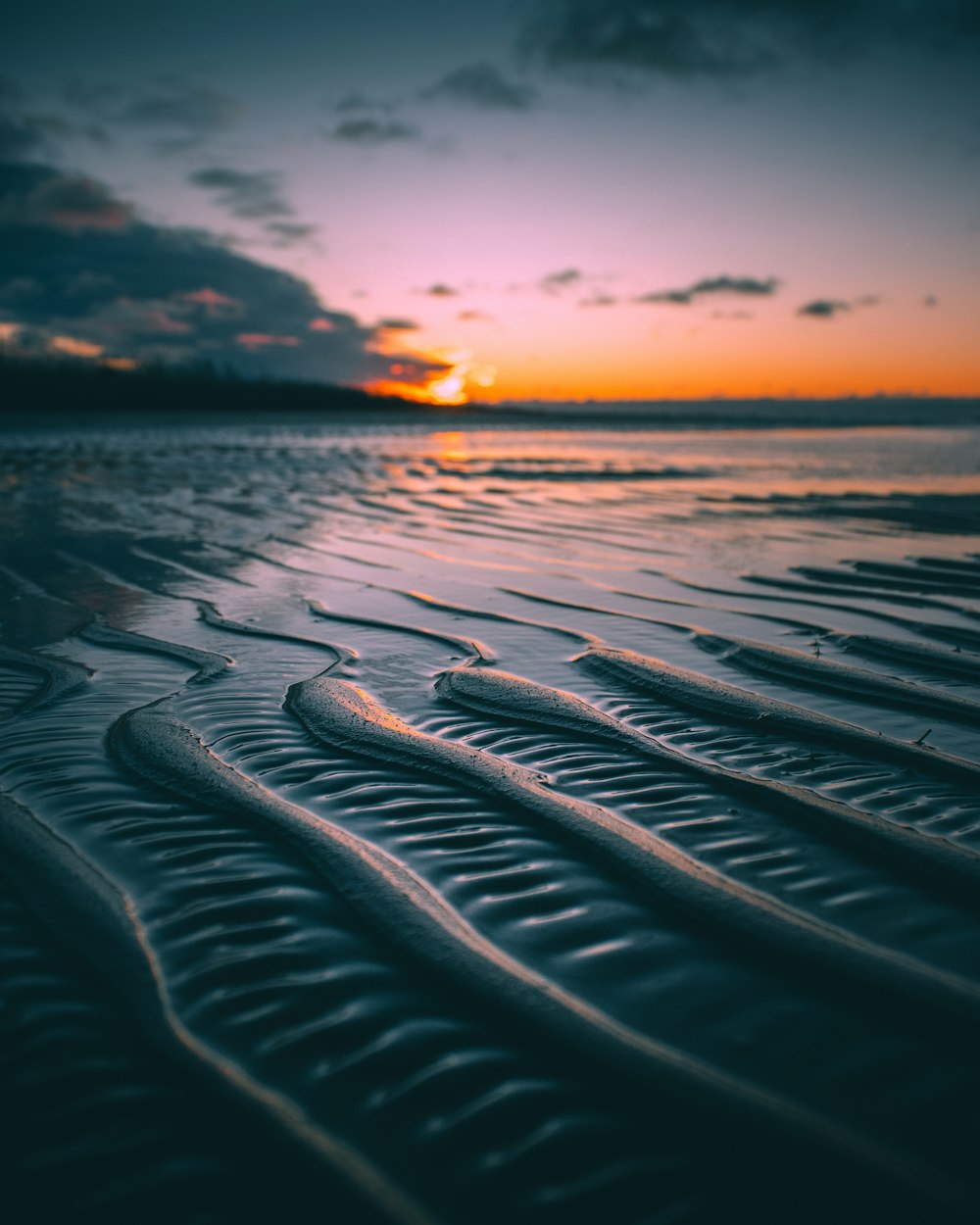 body of water during sunset