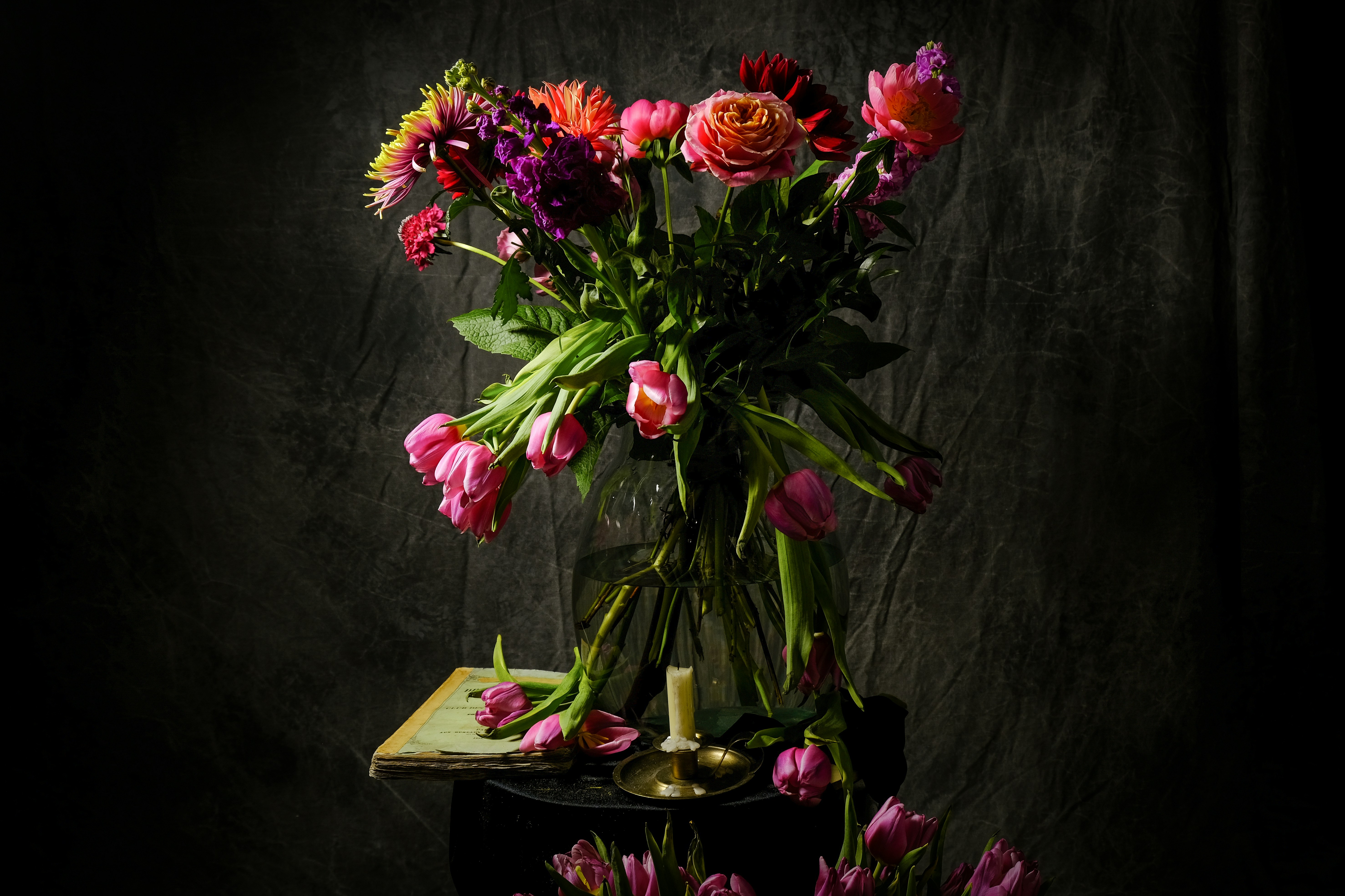 pink and red flowers on brown wooden table