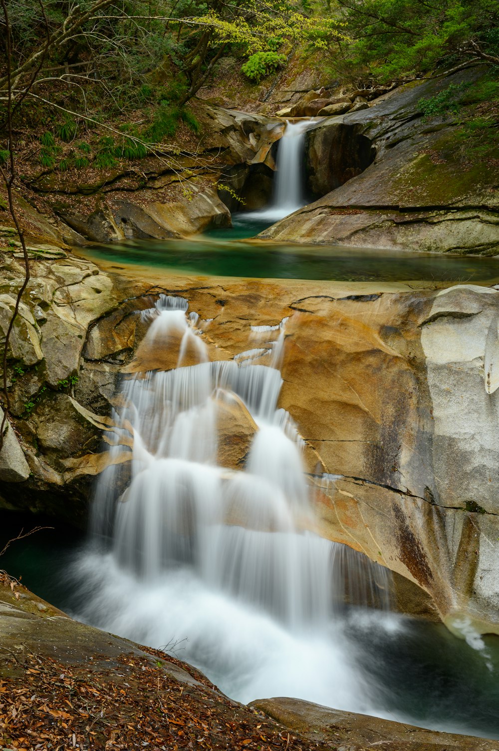 water falls on gray rock