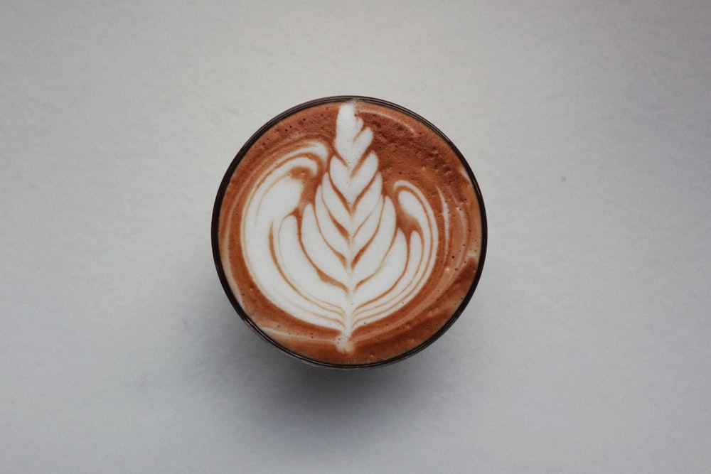 brown and white heart shaped coffee art