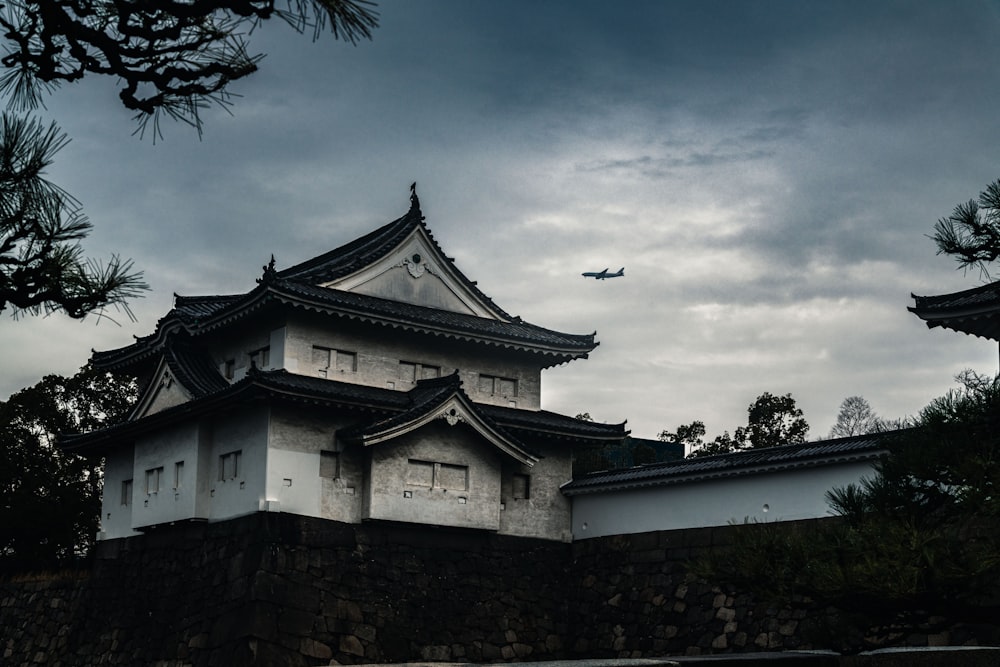 white and black temple under white clouds