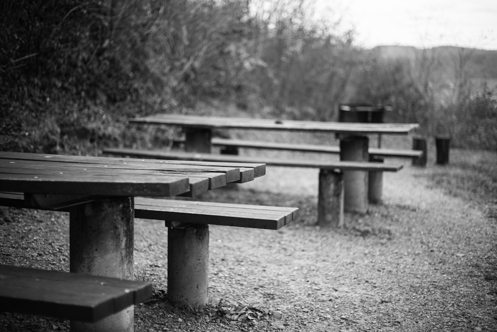 grayscale photo of wooden bench